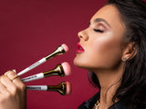 Model posing with Killer Impression Killer Base brushes